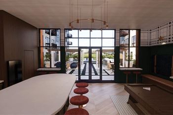 a large room with a white table and chairs and large windows